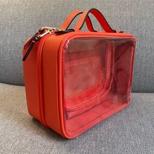 CALPAK medium clear cosmetics bag in papaya